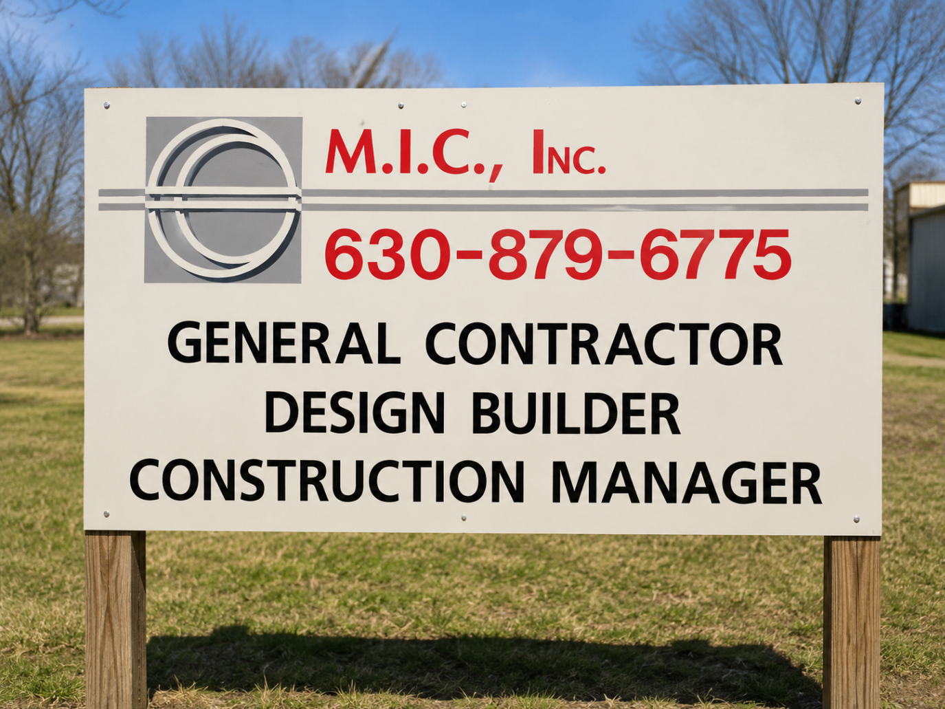 M.I.C., Inc. general contractor sign in red and black